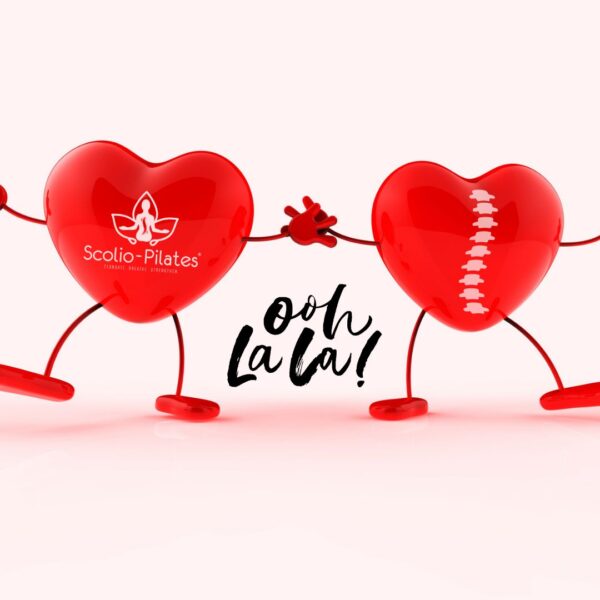 Two red heart characters with SP logo dancing playfully together under the text "Ooh La La!" on a soft pink background.
