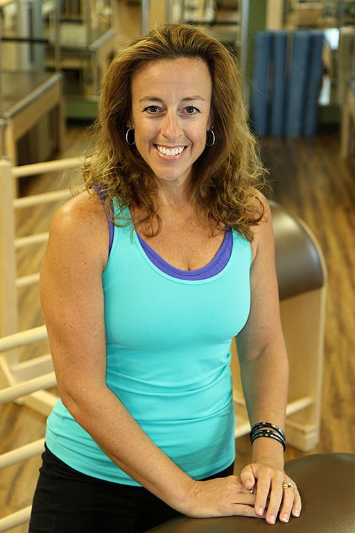 Amy Dixon, Authorized Scolio-Pilates practitioner in Winston-Salem, North Carolina, smiling in a professional portrait