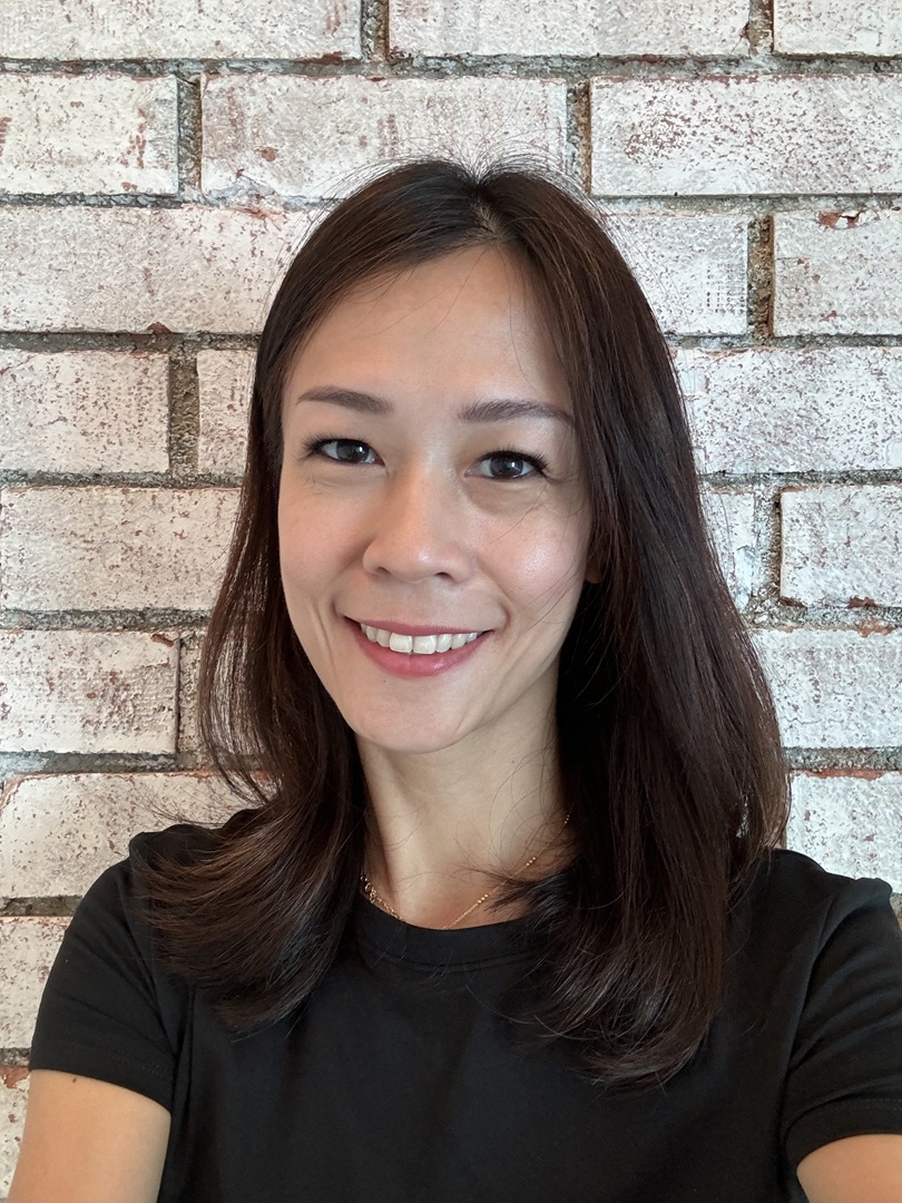 Eliza Lin, Authorized Scolio-Pilates practitioner in Singapore, smiling in a professional portrait