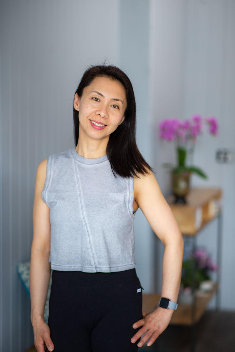 Erine Budiman, Authorized Scolio-Pilates practitioner in Melbourne, Australia, smiling in a professional portrait