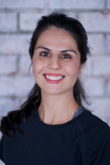 Leticia Roxo, Scolio-Pilates educator and practitioner in Dubai, United Arab Emirates, smiling in a professional portrait