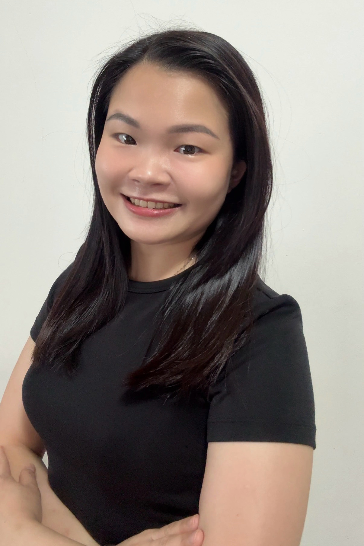 Joanne Goh, Authorized Scolio-Pilates practitioner in Singapore and Johor Bahru, Malaysia, smiling in a professional portrait