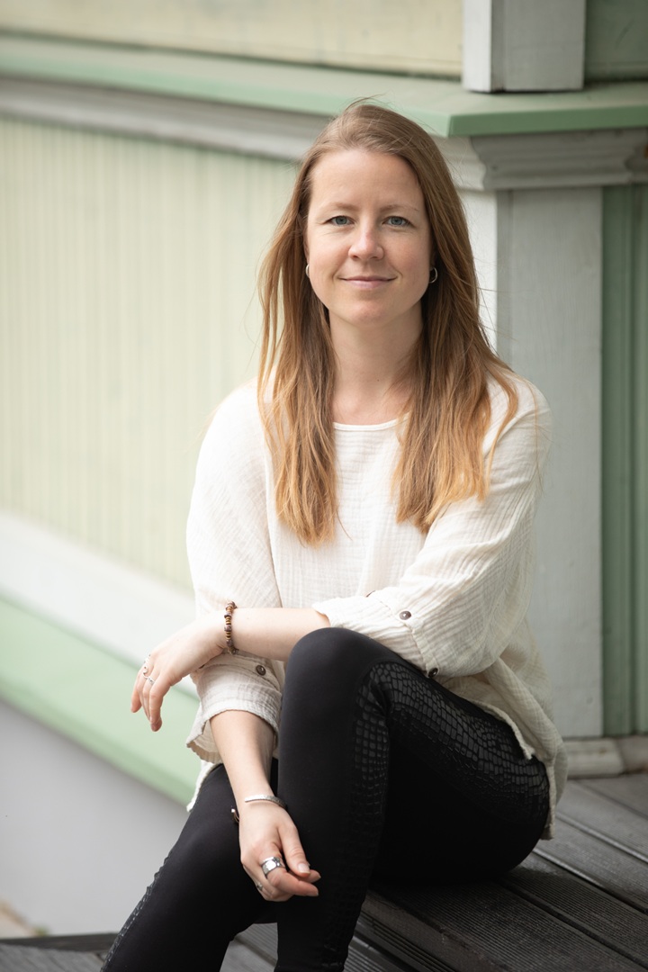 Kristina Orlova, Authorized Scolio-Pilates practitioner in Tallinn, Estonia, seated in a professional portrait