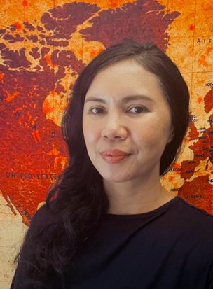 Lanel Hosomi, Scolio-Pilates educator and practitioner in Ho Chi Minh City, Vietnam, smiling in a professional portrait