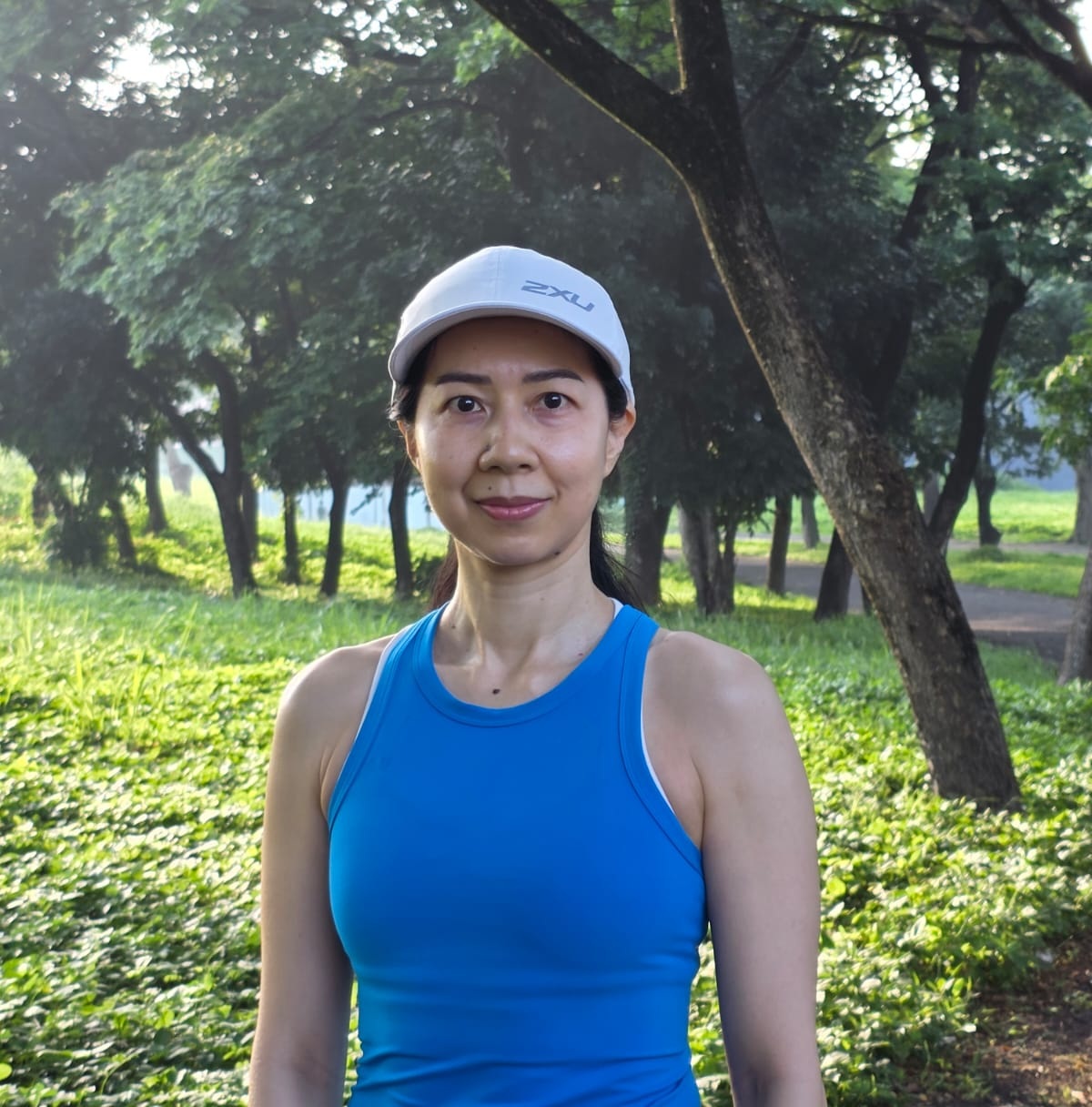 Lesvinawati Amoy Nghok Beng, Authorized Scolio-Pilates practitioner in Surabaya, Indonesia, smiling outdoors