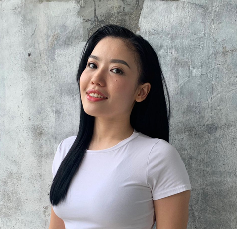 Maliana Chen, Authorized Scolio-Pilates practitioner in Bali, Indonesia, smiling in a professional portrait