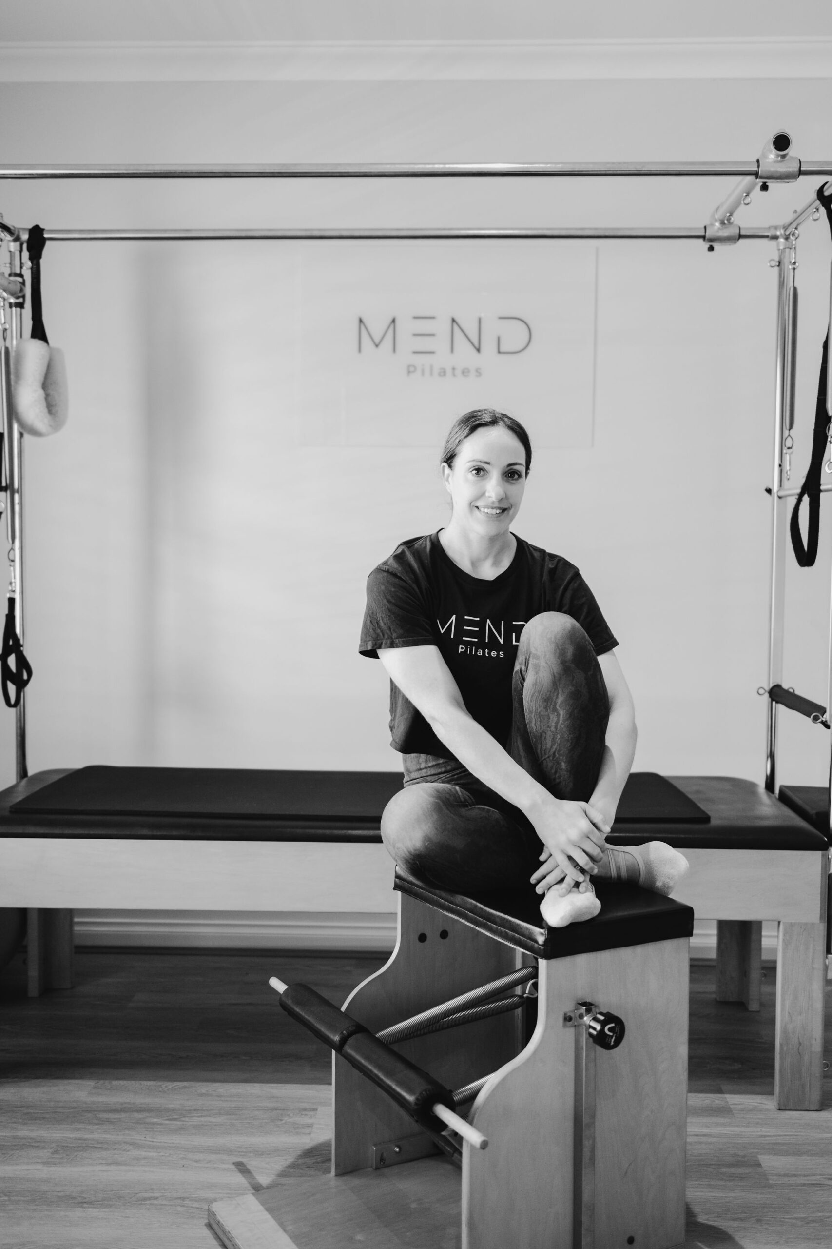 Mariana Borovina, Authorized Scolio-Pilates practitioner serving Perth, Australia, and Split, Croatia, in a black and white professional portrait in her studio
