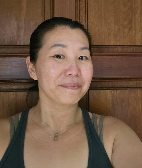 Marylin Tan, Authorized Scolio-Pilates practitioner in Kuala Lumpur and Singapore, smiling in a professional portrait