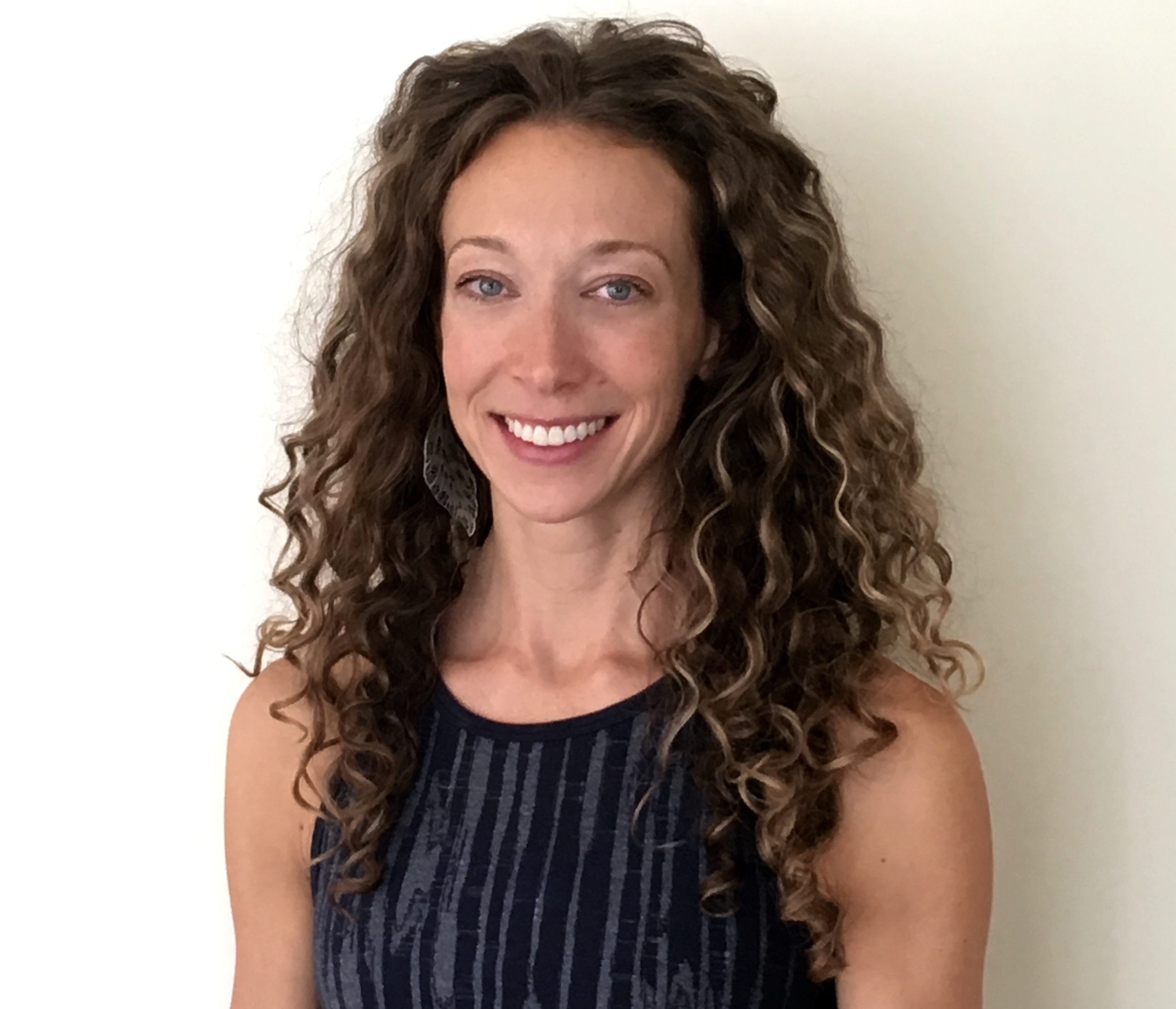 Michelle, Authorized Scolio-Pilates practitioner in Boulder, Colorado, smiling in a professional portrait