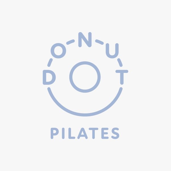 Donut Pilates logo in light blue, with "DONUT" arranged in a circular pattern above the word "PILATES."